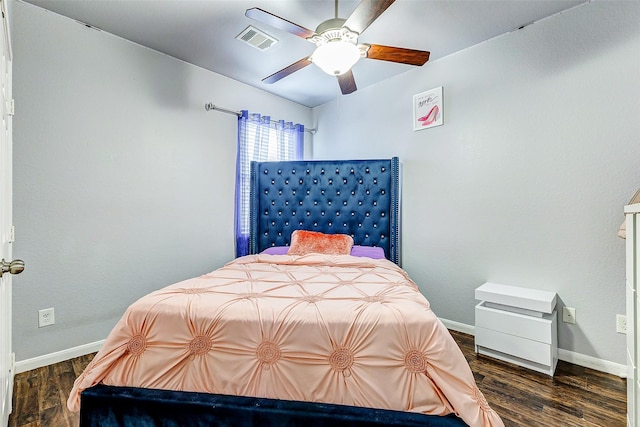 bedroom with dark wood-type flooring and ceiling fan