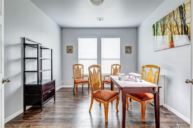 dining room featuring dark wood-type flooring