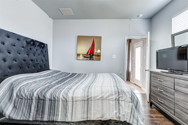 bedroom featuring wood-type flooring