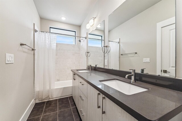 bathroom with shower / tub combo, vanity, and tile patterned flooring