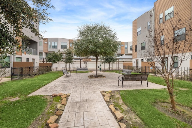 surrounding community featuring a yard and a patio area