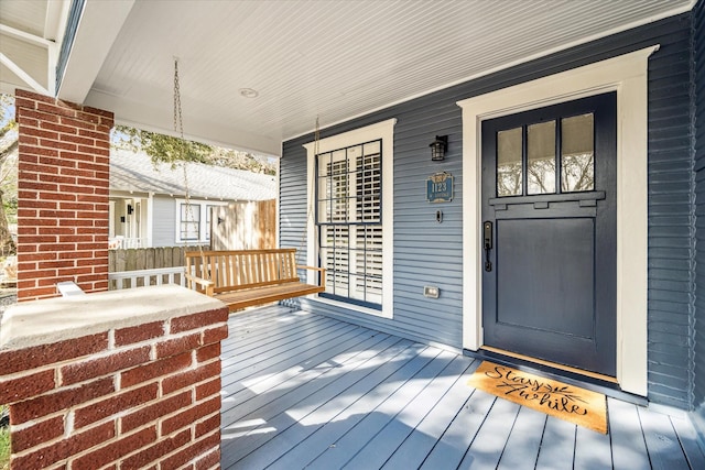 doorway to property featuring a porch