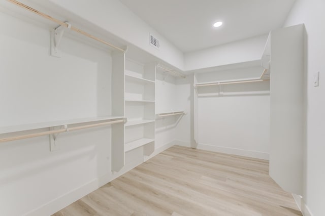 spacious closet featuring light wood-type flooring