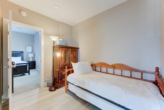 bedroom with light hardwood / wood-style floors