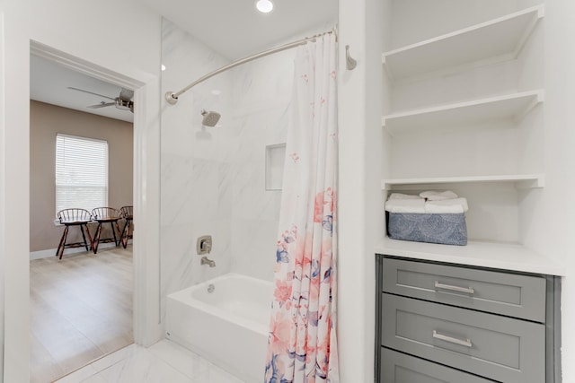 bathroom featuring shower / tub combo and ceiling fan