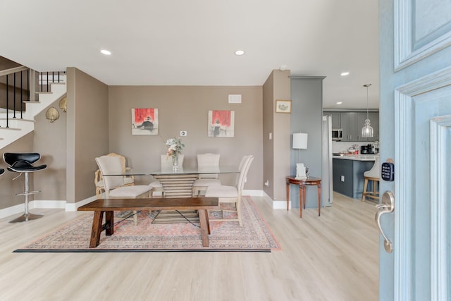 dining space featuring light hardwood / wood-style flooring