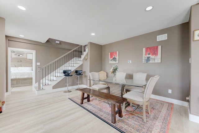 dining area with light hardwood / wood-style floors