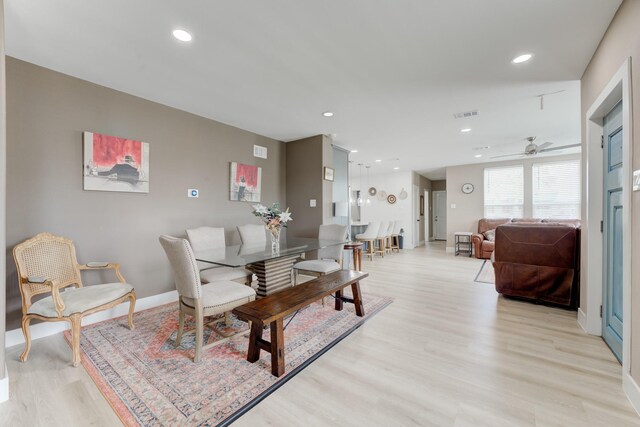 dining area with light wood-type flooring