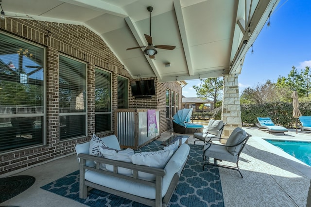 view of patio with an outdoor living space, a fenced in pool, and ceiling fan