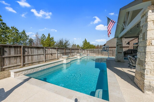 view of pool with a patio