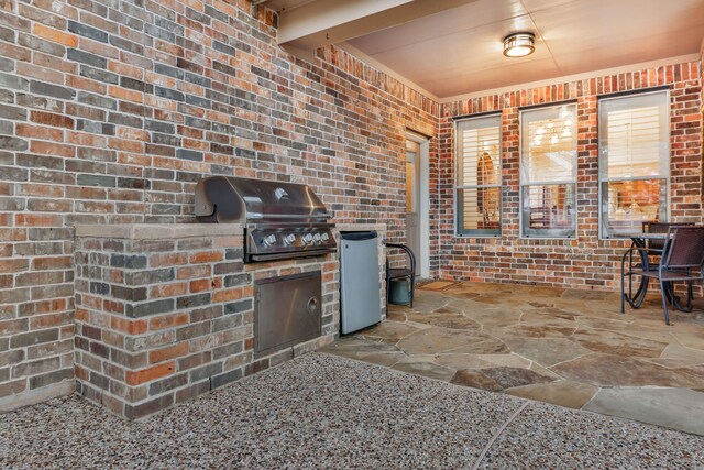 view of patio / terrace with grilling area and an outdoor kitchen