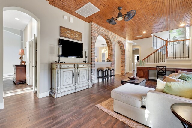 living room with high vaulted ceiling, wooden ceiling, dark hardwood / wood-style floors, and ceiling fan