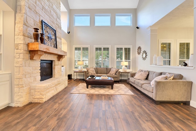 living room featuring dark hardwood / wood-style floors and a fireplace