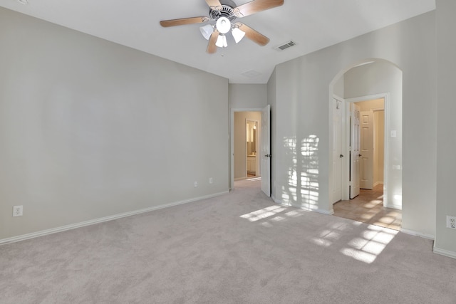 unfurnished bedroom featuring light carpet and ceiling fan