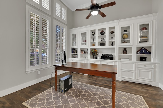 office area featuring crown molding, dark hardwood / wood-style floors, and ceiling fan