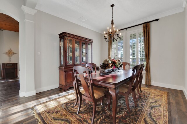 dining space featuring a notable chandelier, dark wood-type flooring, and ornamental molding