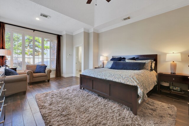 bedroom with ornamental molding, dark wood-type flooring, and ceiling fan