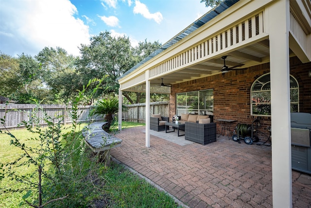 view of patio / terrace featuring ceiling fan and an outdoor living space