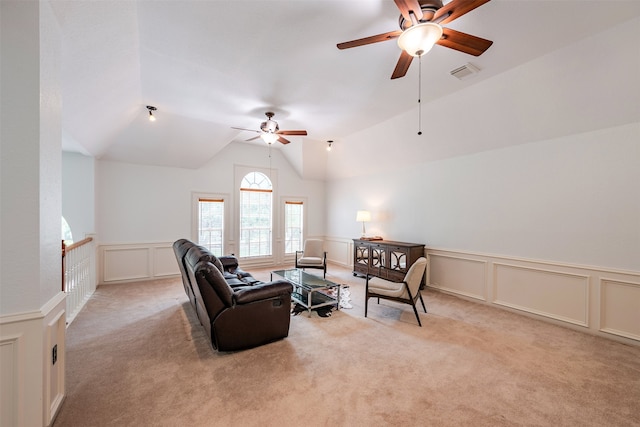 living room featuring vaulted ceiling and light carpet