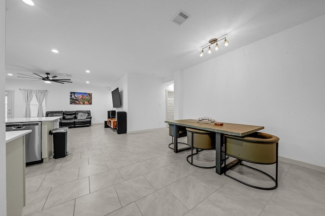 tiled dining area with ceiling fan