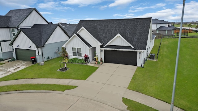 modern farmhouse featuring a garage, central AC unit, and a front yard