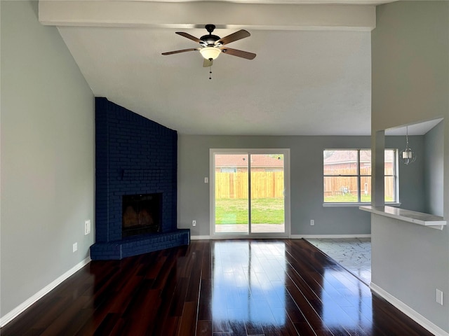 unfurnished living room featuring hardwood / wood-style flooring, ceiling fan with notable chandelier, lofted ceiling with beams, and a brick fireplace