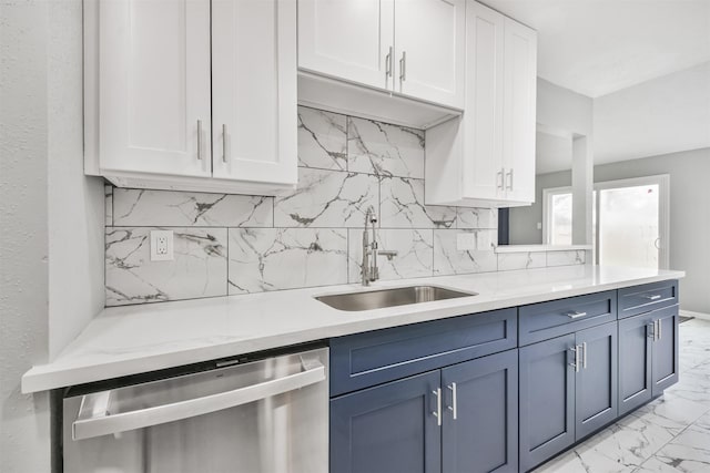 kitchen with white cabinetry, dishwasher, sink, and blue cabinets