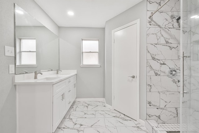 bathroom featuring vanity and tiled shower