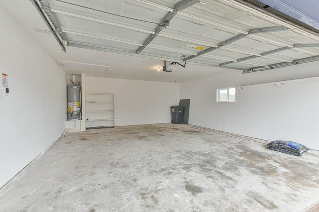 garage with a garage door opener and gas water heater