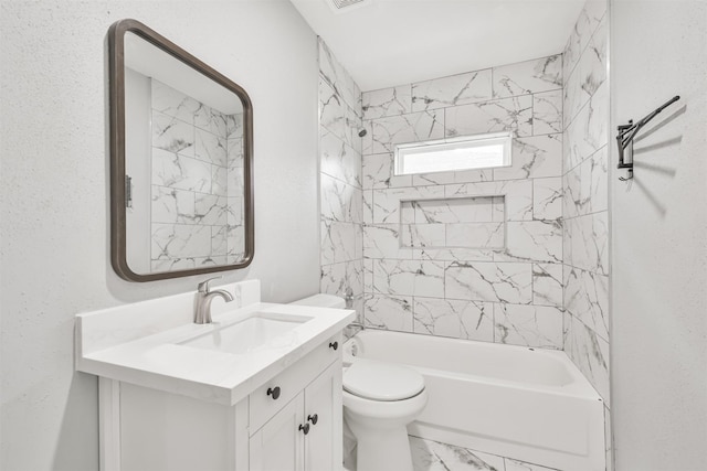 full bathroom featuring vanity, toilet, and tiled shower / bath