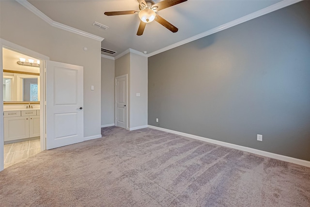 unfurnished bedroom featuring crown molding, light colored carpet, connected bathroom, and sink