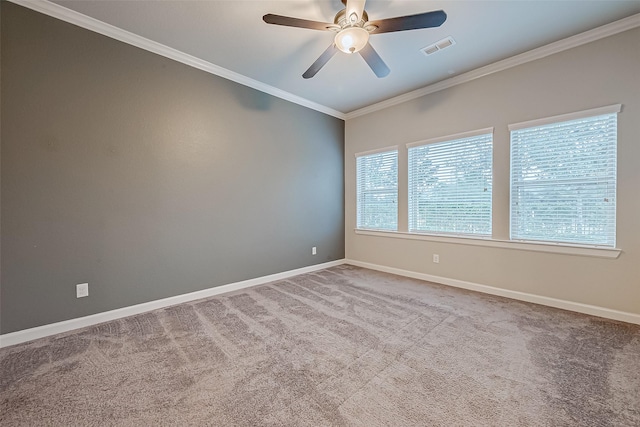 empty room with ornamental molding, light carpet, and ceiling fan