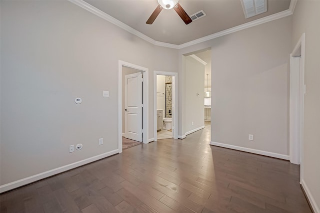 spare room with ornamental molding, ceiling fan, and dark hardwood / wood-style flooring