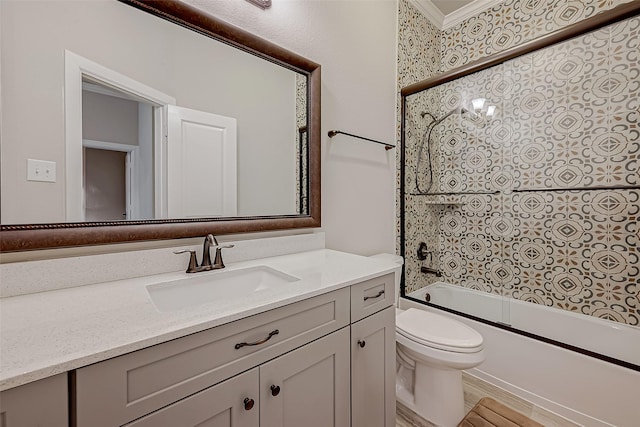 full bathroom with vanity, shower / bath combination with glass door, and toilet