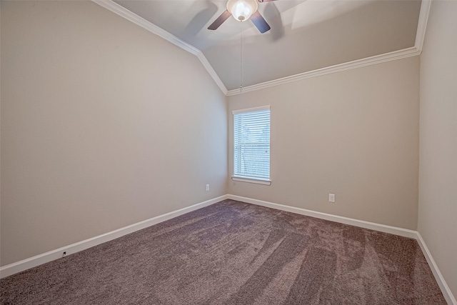 carpeted spare room featuring lofted ceiling, ornamental molding, and ceiling fan