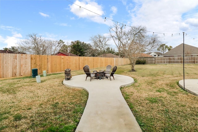 view of yard featuring a patio and a fire pit