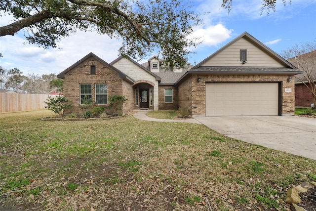 view of front facade with a garage and a front yard