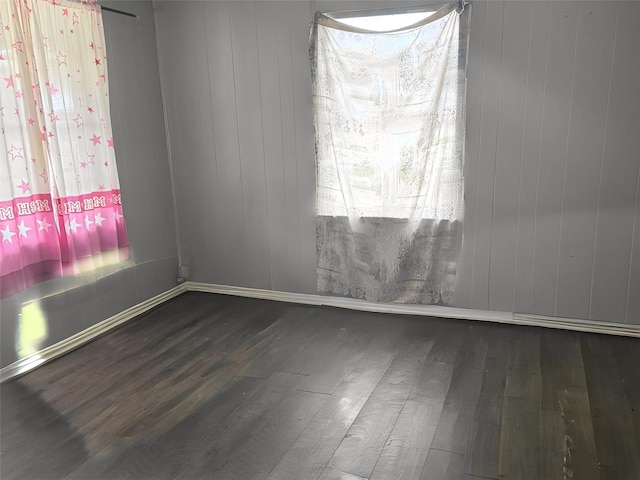 spare room featuring dark hardwood / wood-style floors