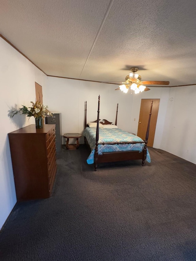 carpeted bedroom with a textured ceiling and ceiling fan