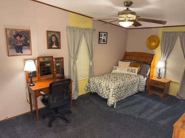 carpeted bedroom with ceiling fan and ornamental molding