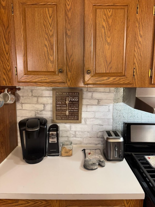 kitchen with tasteful backsplash and stove