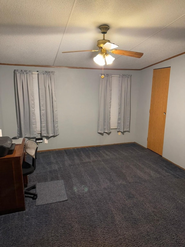 unfurnished office with crown molding, carpet flooring, ceiling fan, and a textured ceiling