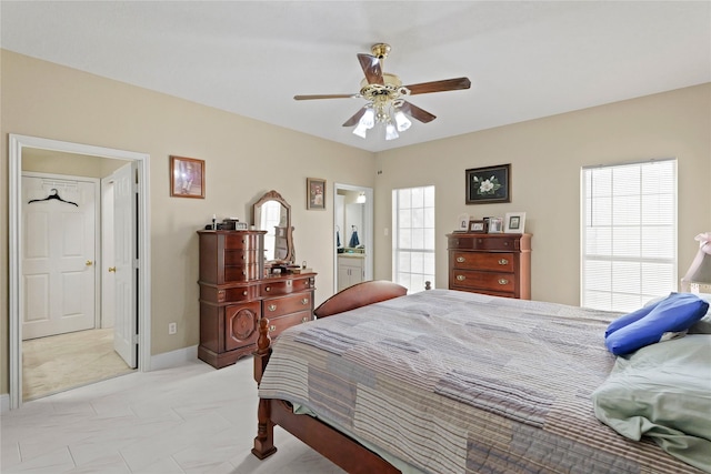 bedroom with ceiling fan and ensuite bathroom