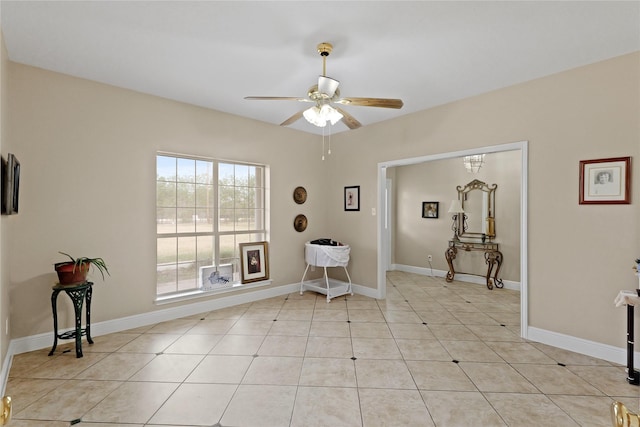 interior space featuring light tile patterned floors and ceiling fan