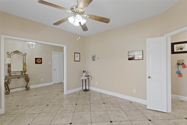 unfurnished room featuring light tile patterned floors and ceiling fan