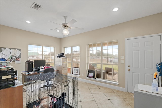 office with ceiling fan and light tile patterned floors