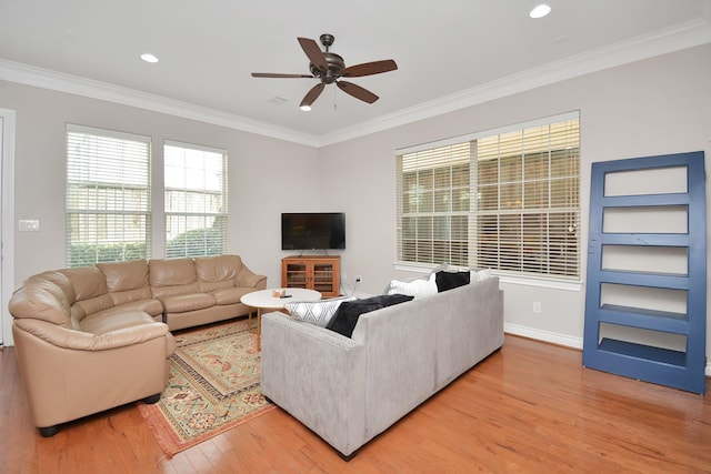 living room featuring ornamental molding, ceiling fan, and light hardwood / wood-style flooring