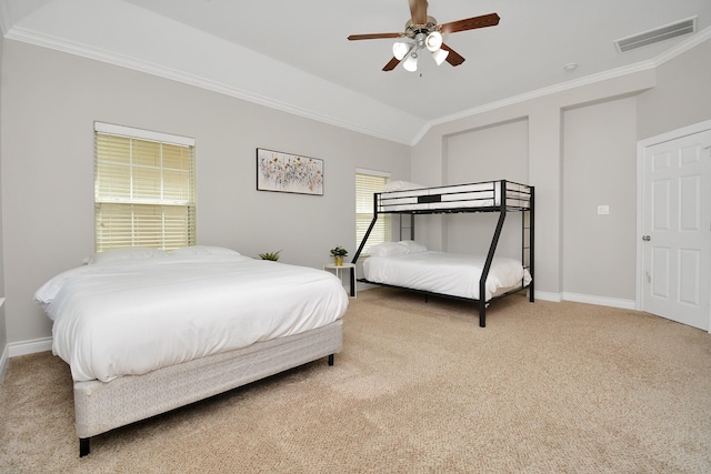 bedroom featuring crown molding, vaulted ceiling, light colored carpet, and ceiling fan