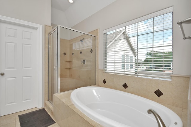 bathroom featuring tile patterned floors and shower with separate bathtub