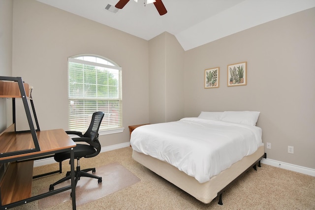 carpeted bedroom featuring lofted ceiling and ceiling fan